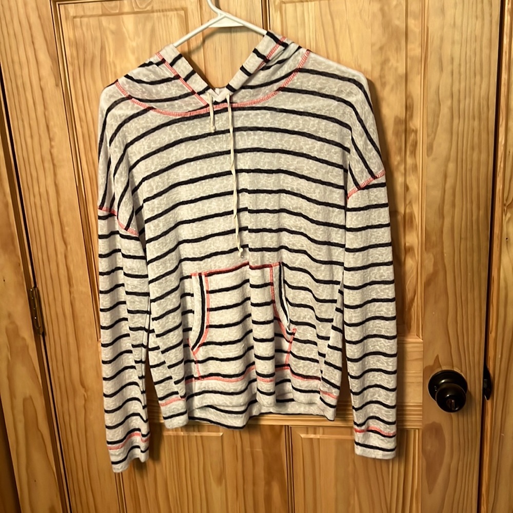 Striped long sleeve shirt with hood.